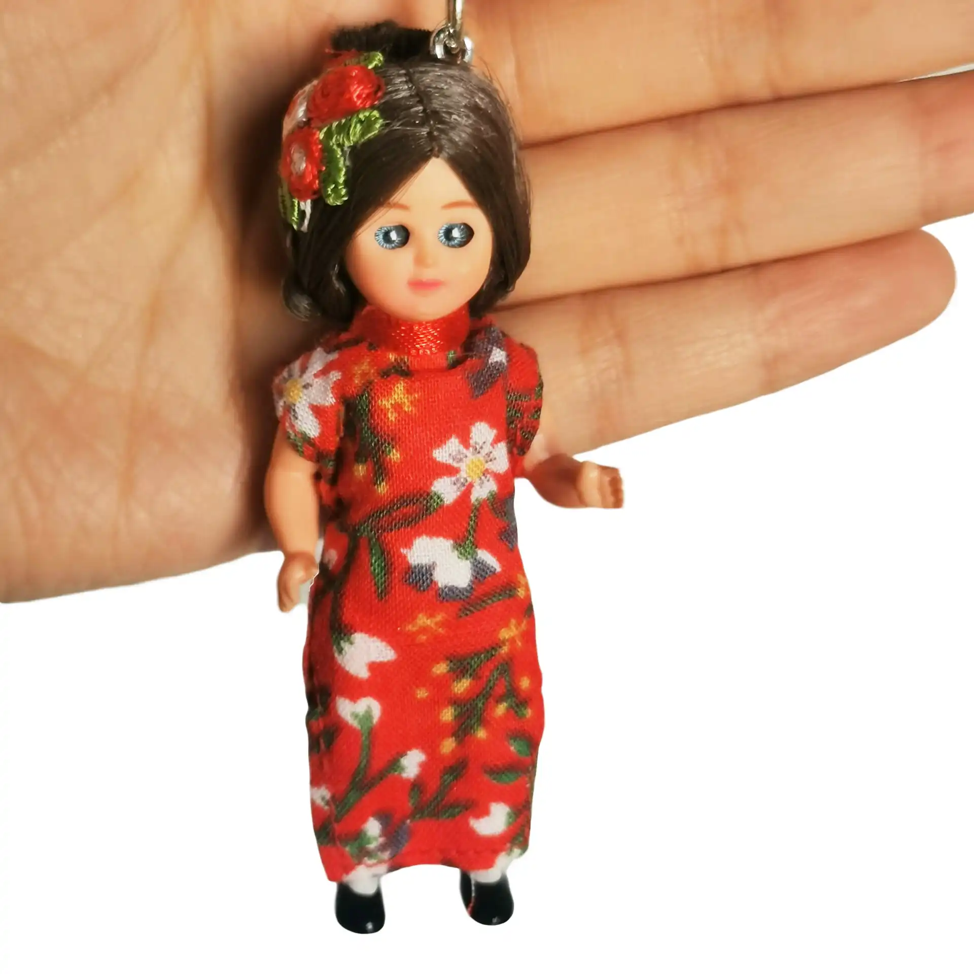 Side view of cheongsam keychain doll showing traditional Chinese dress styling and proportions.