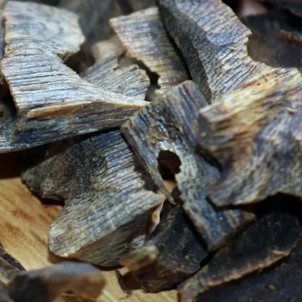 ​​Premium packaging of 100g Vietnam underwater oud chips ready for shipping worldwide.