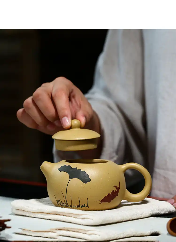 Complete traditional tea set arrangement with Xi Shi Yixing teapot as elegant centerpiece.