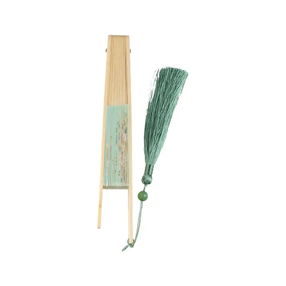 Performance art scene with dancer using round bamboo fan as expressive prop.