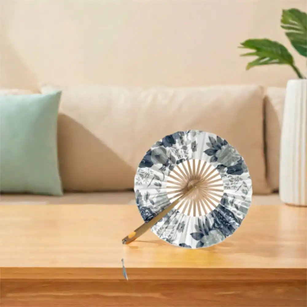 Multiple angle view showing fan profile thickness and elegant curved design when folded for travel.