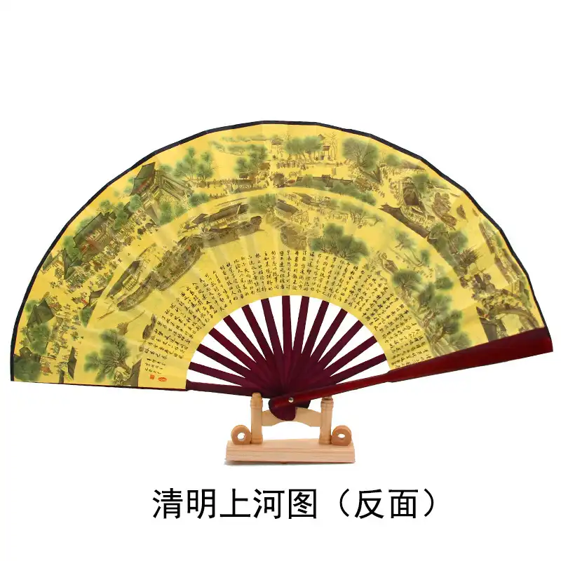 Traditional Chinese setting with fan alongside cultural artifacts showing authentic heritage context.