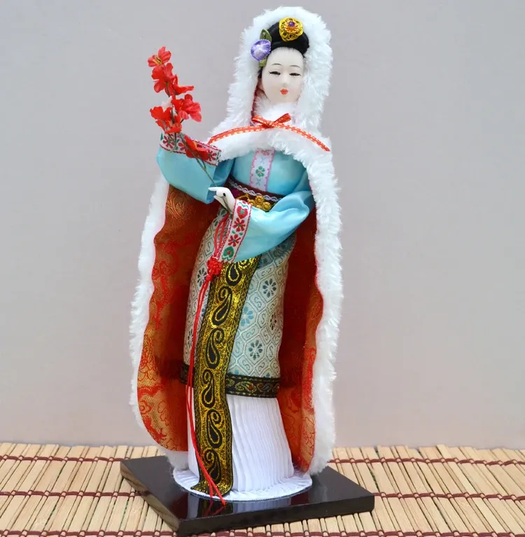 Traditional opera sleeve design and flowing fabric details on porcelain doll costume.