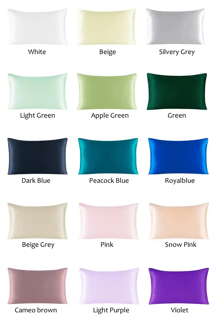 Multiple color options of silk pillowcases displayed on elegant bedroom setting.