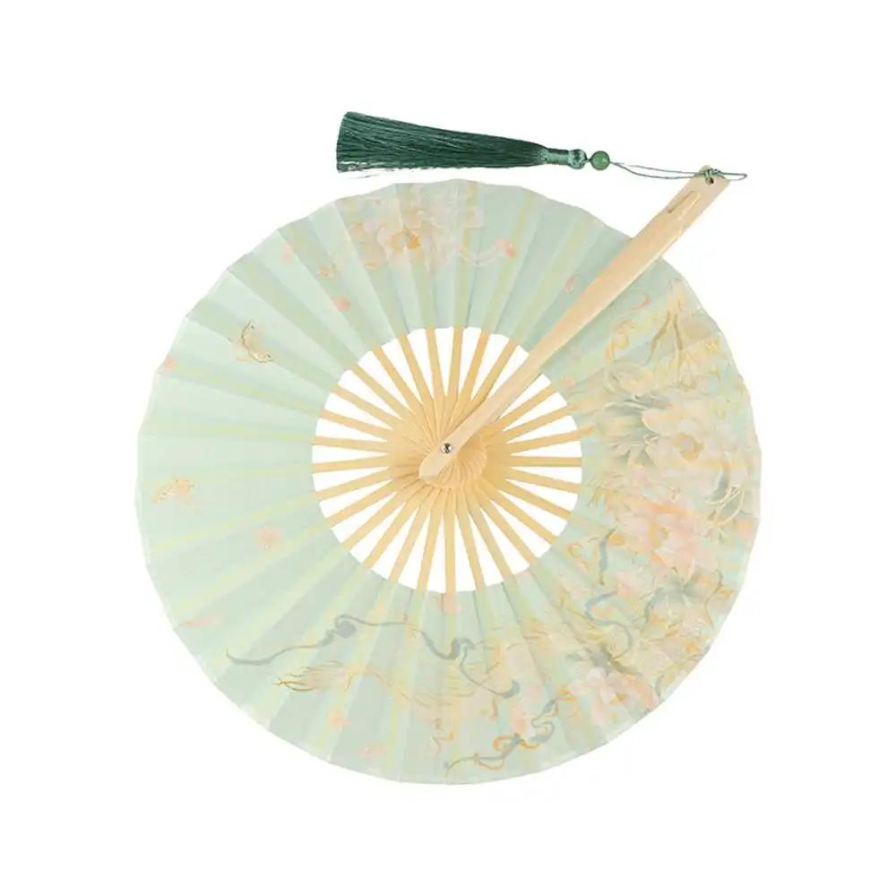 Traditional Japanese setting featuring round silk fan as authentic cultural element.