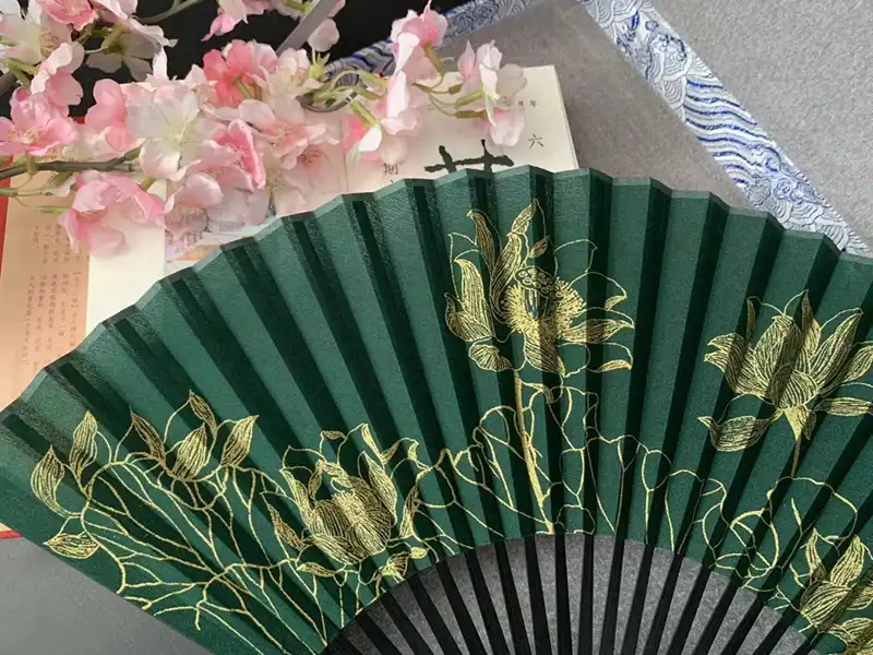 Japanese 8-inch bamboo folding fan for men with green forest design displayed fully open.