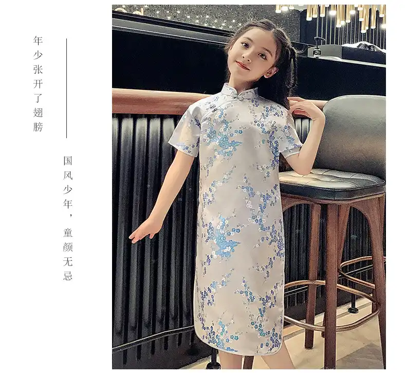 Child in traditional qipao dress demonstrating comfortable fit and elegant silhouette.
