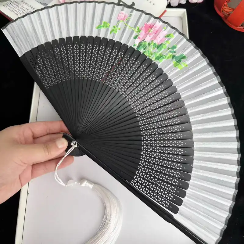 Retro style dragonfly fan displayed showing sector shape and traditional Japanese design elements.