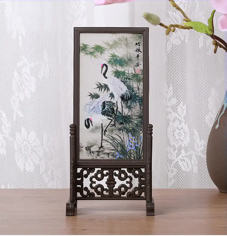 Chinese landscape artwork showing serene water and mountain elements in desktop display.