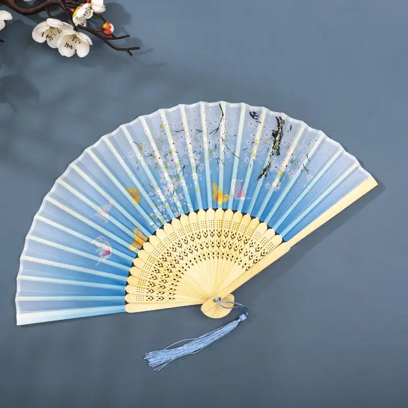 Art craft workshop displaying handmade silk bamboo fan construction process steps.