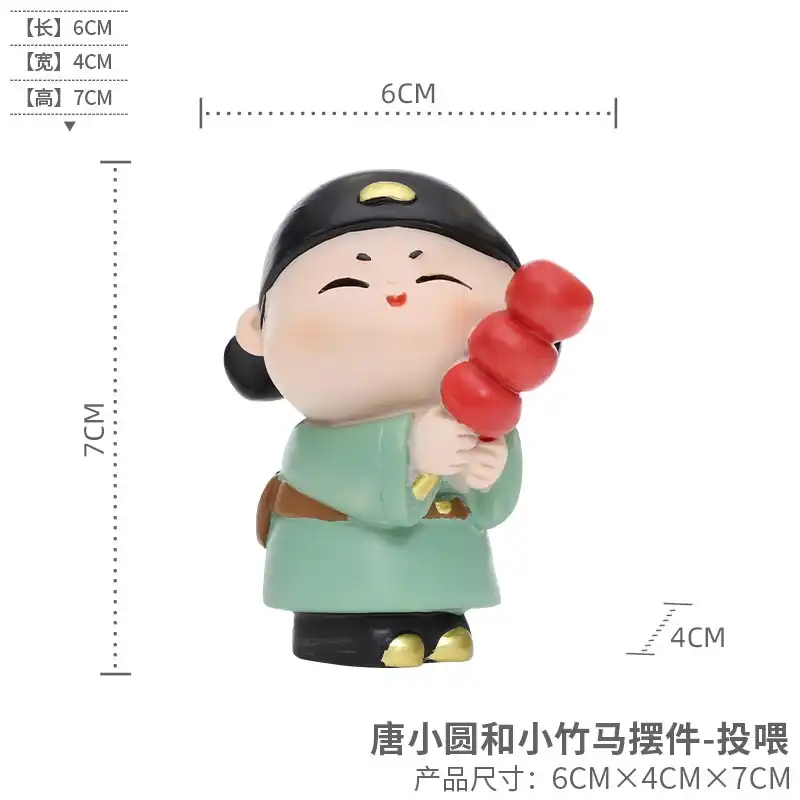 Datang handmaiden doll displayed with other Chinese cultural items.