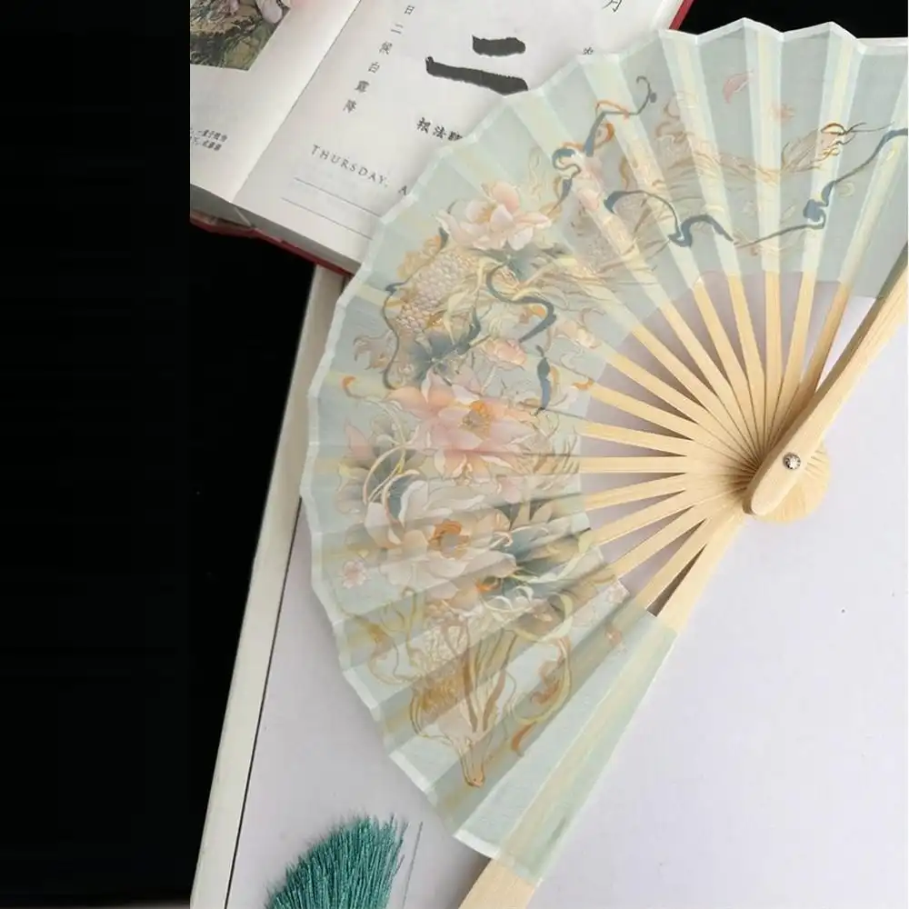Japanese round fan used as photography prop in creative portrait session.