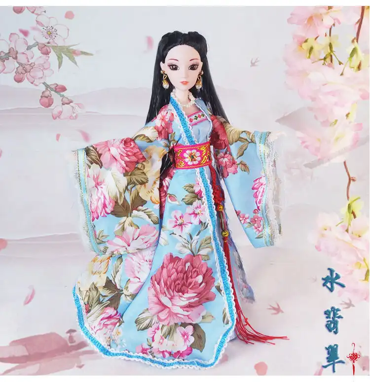 Chinese fashion doll in traditional pose showing cultural costume and authentic styling.