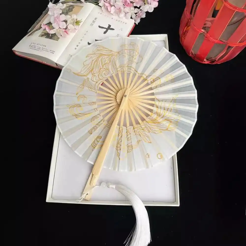 Professional model holding round bamboo fan in fashion photography shoot.