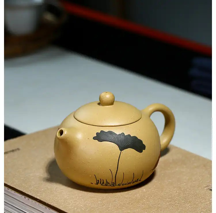 Traditional Chinese tea ceremony featuring classic Xi Shi Yixing purple clay beauty teapot.