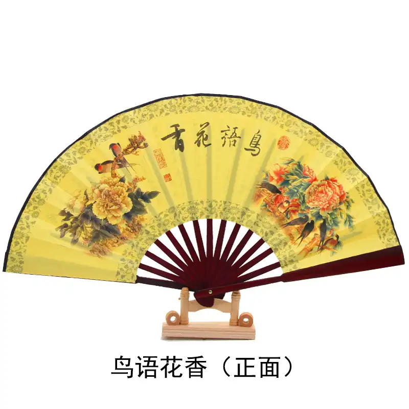 Gift presentation of bamboo fan in elegant packaging suitable for special occasions and cultural gifts.