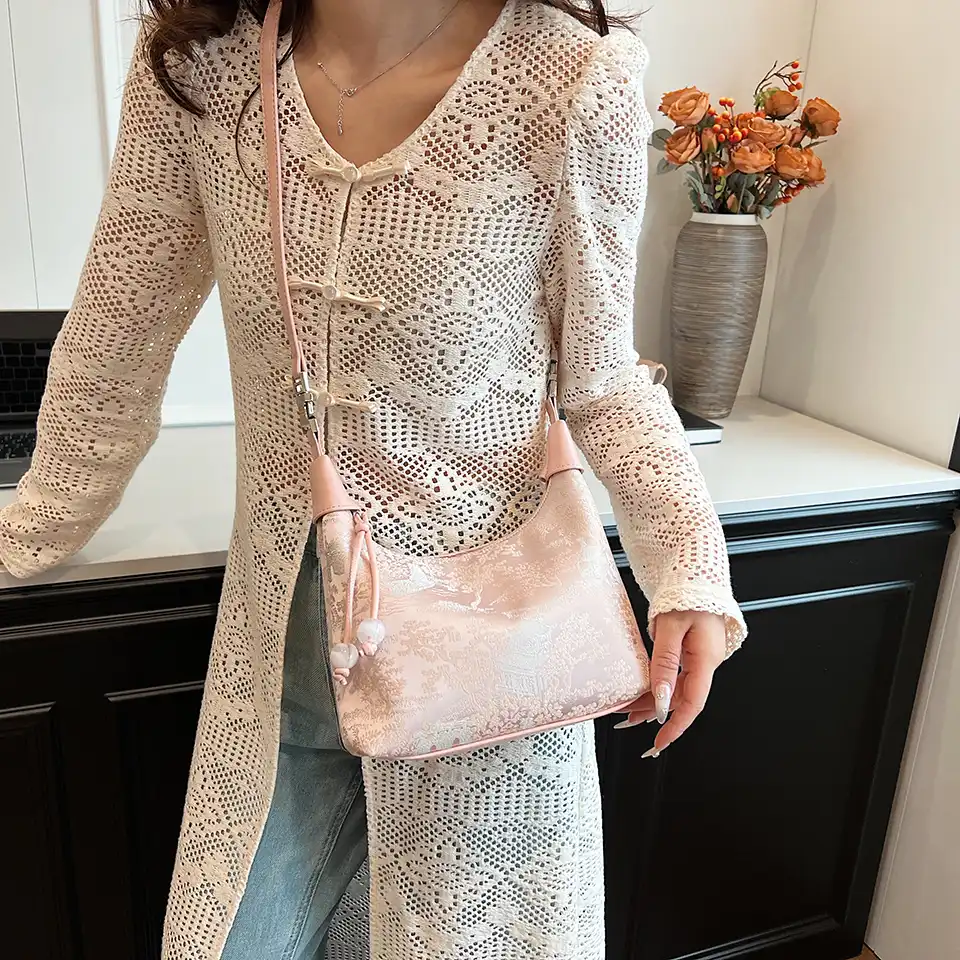 Traditional artistry meets modern fashion in designer embroidery bag.