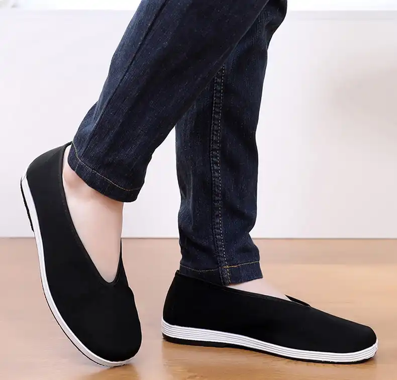 Group training class showing multiple practitioners wearing authentic Chinese martial arts shoes.