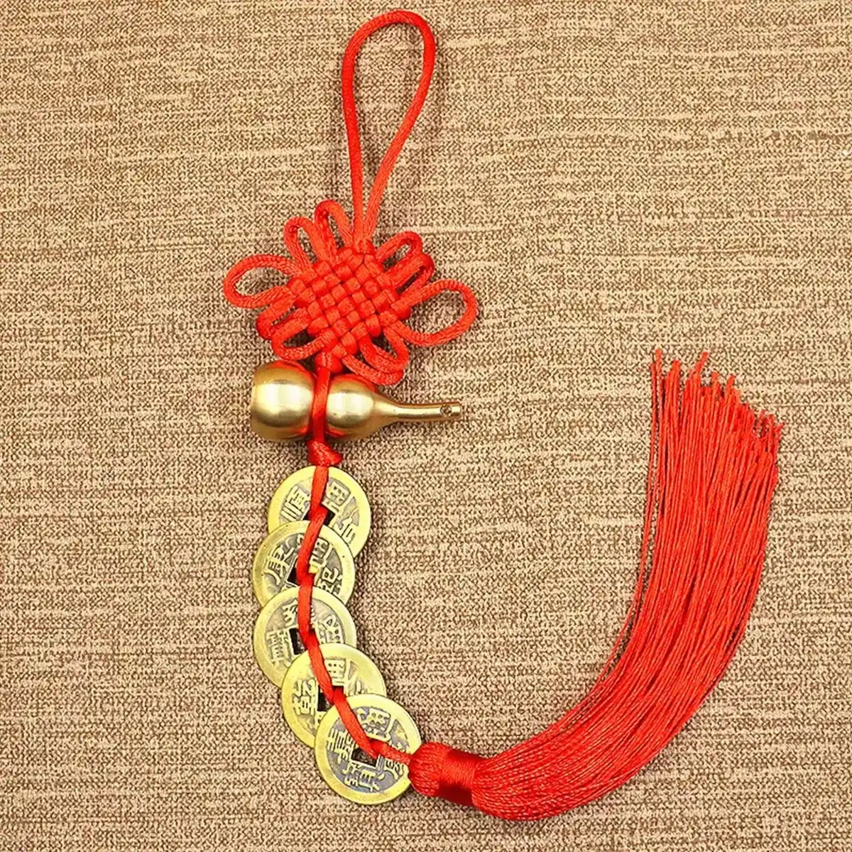 Detailed craftsmanship showing copper gourd and chinese lucky coins arrangement.
