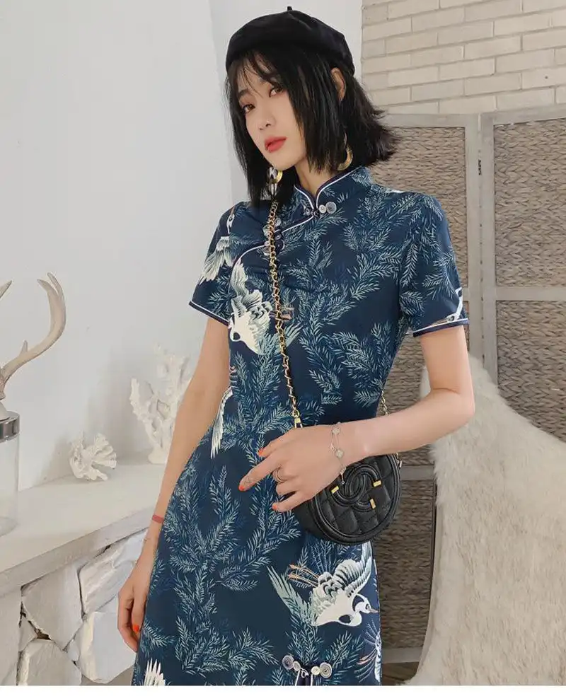 Model in A-line qipao demonstrating comfort and movement in twill fabric construction.