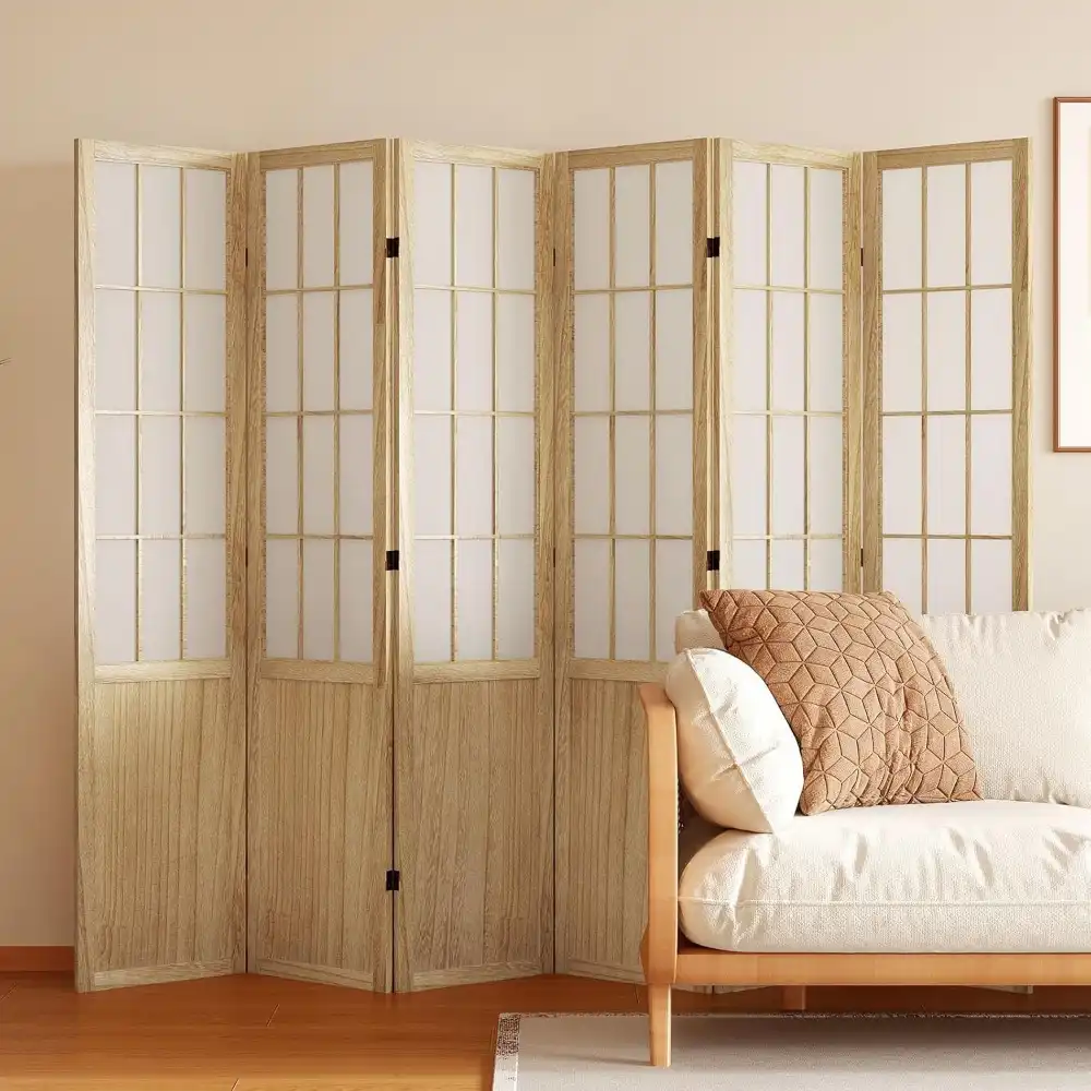 Chinese screen divider positioned in office setting creating separate workspace with Asian style.