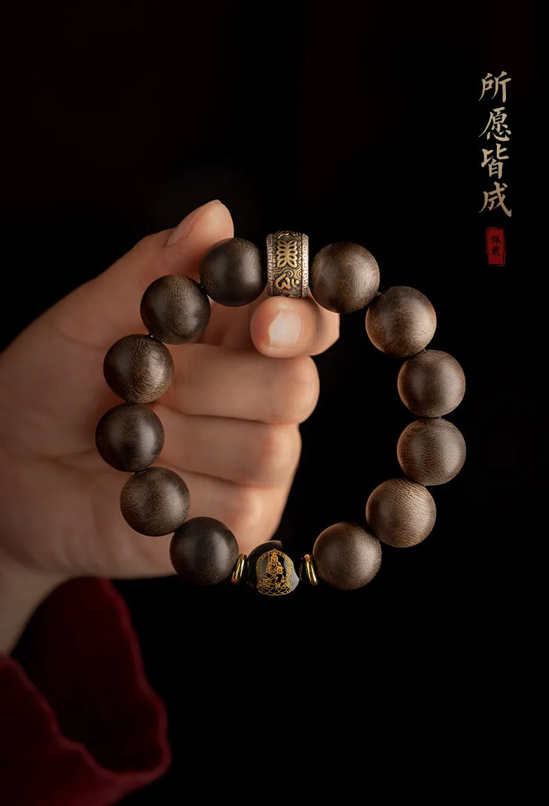 Side angle showing craftsmanship quality of agarwood beads and Buddha zodiac protection charm.