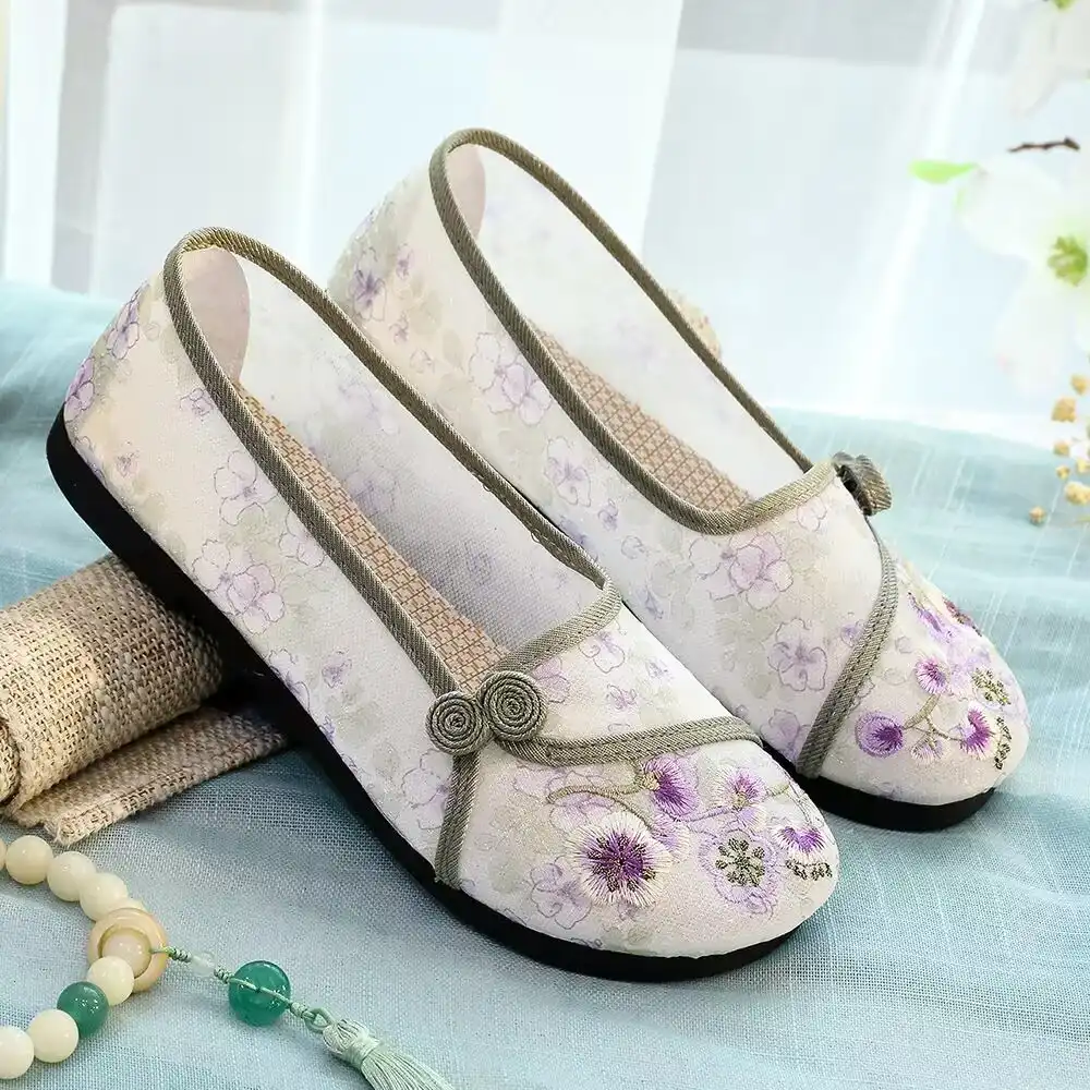 Breathable cotton material close-up showing quality construction of Chinese cloth shoes.