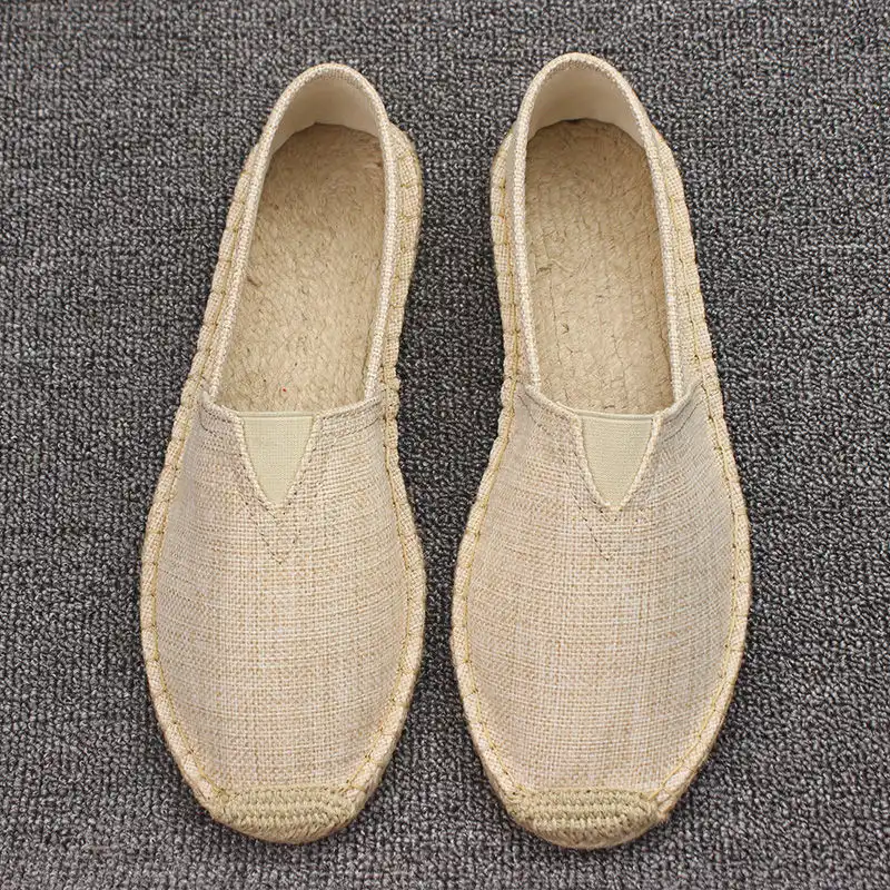 Traditional Chinese shoes displayed with cultural elements showing authentic heritage design.