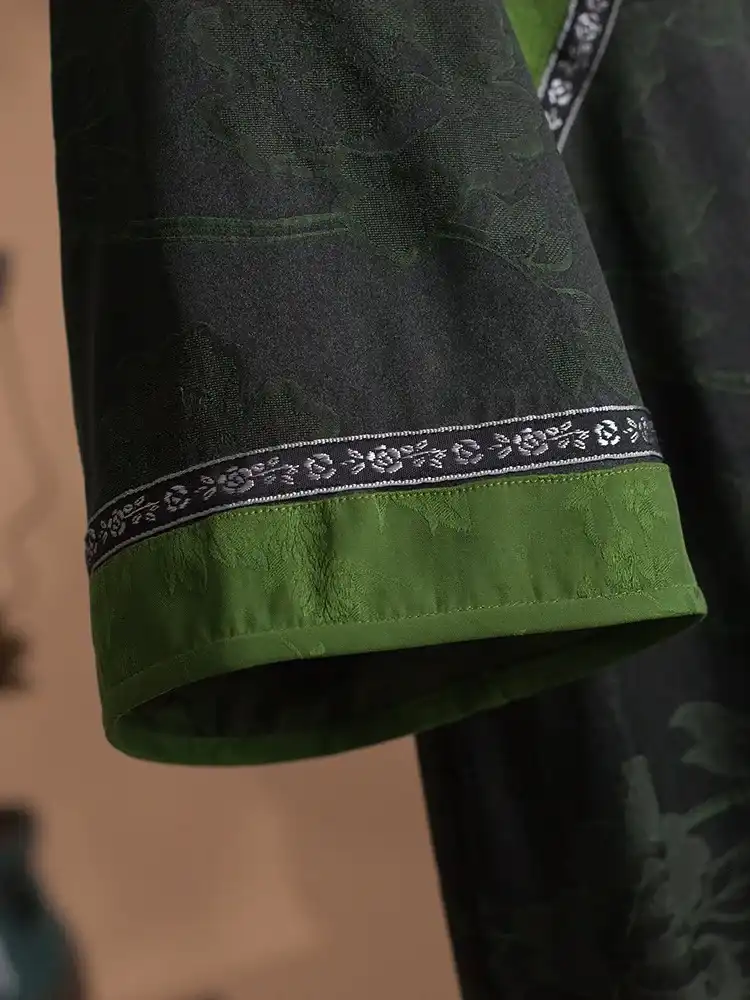 Side profile showing flattering silhouette of premium Xiangyunsha mulberry silk cheongsam dress.