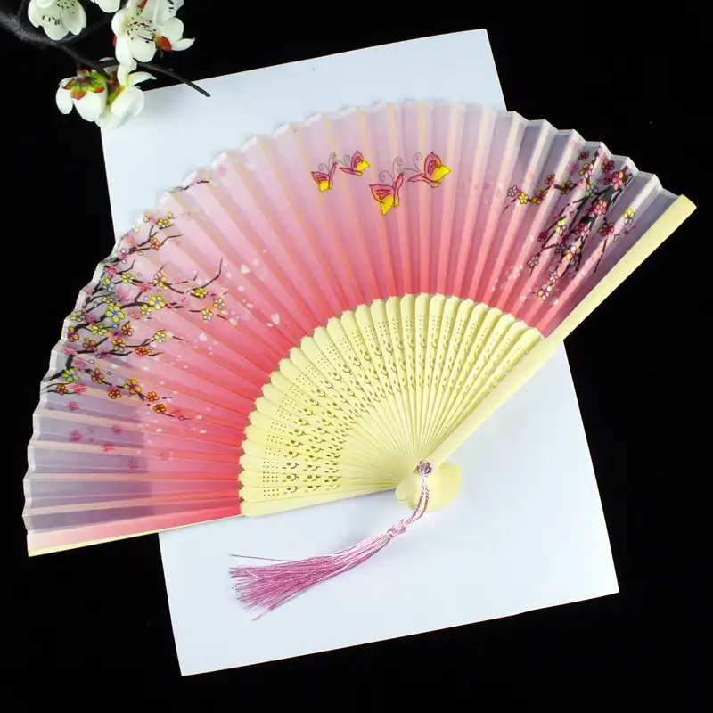 Room interior decoration with Chinese fan displayed as sophisticated wall art.