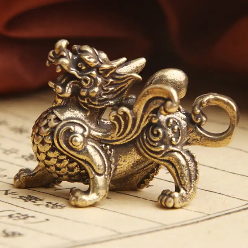 Detail shot of brass Qilin statue base showing craftsmanship quality and material finish.