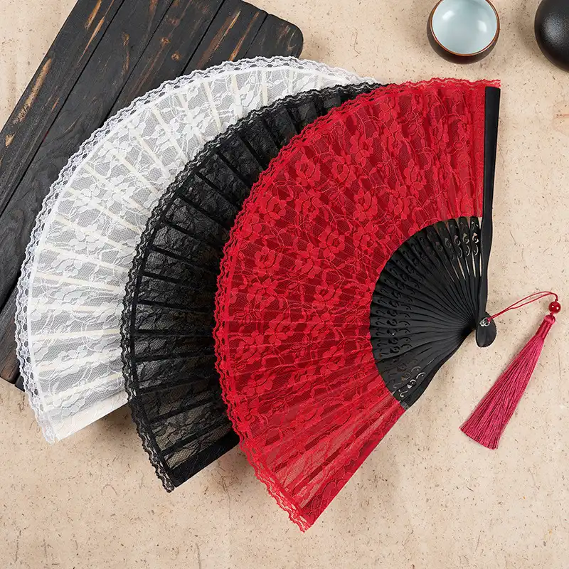 Professional model wearing cheongsam while holding Japanese bamboo lace fan accessory.