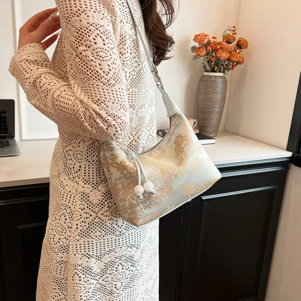 Casual styling of embroidered handbag with modern outfit for everyday use.