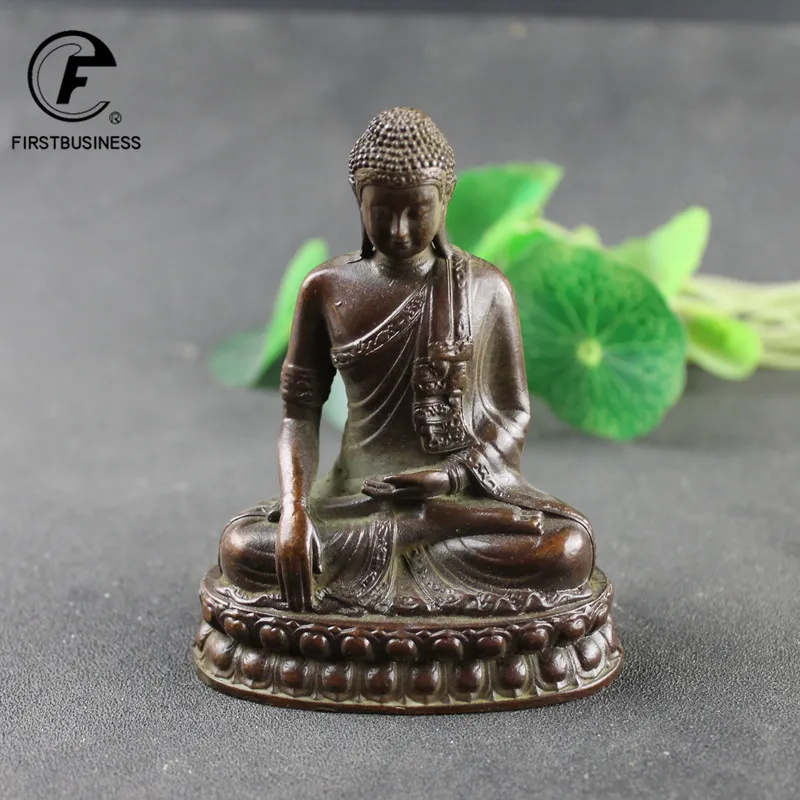 Size comparison of brass Buddha statue with hand showing compact dimensions for home decor.