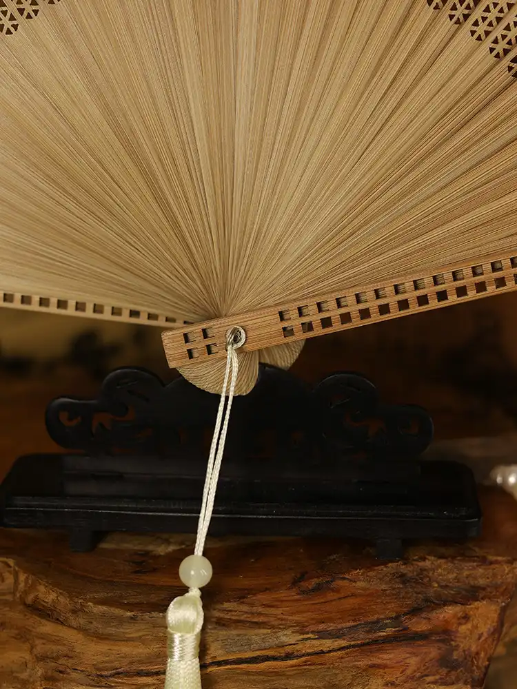 Beige bamboo fan showing neutral tone option perfect for versatile styling and occasions.