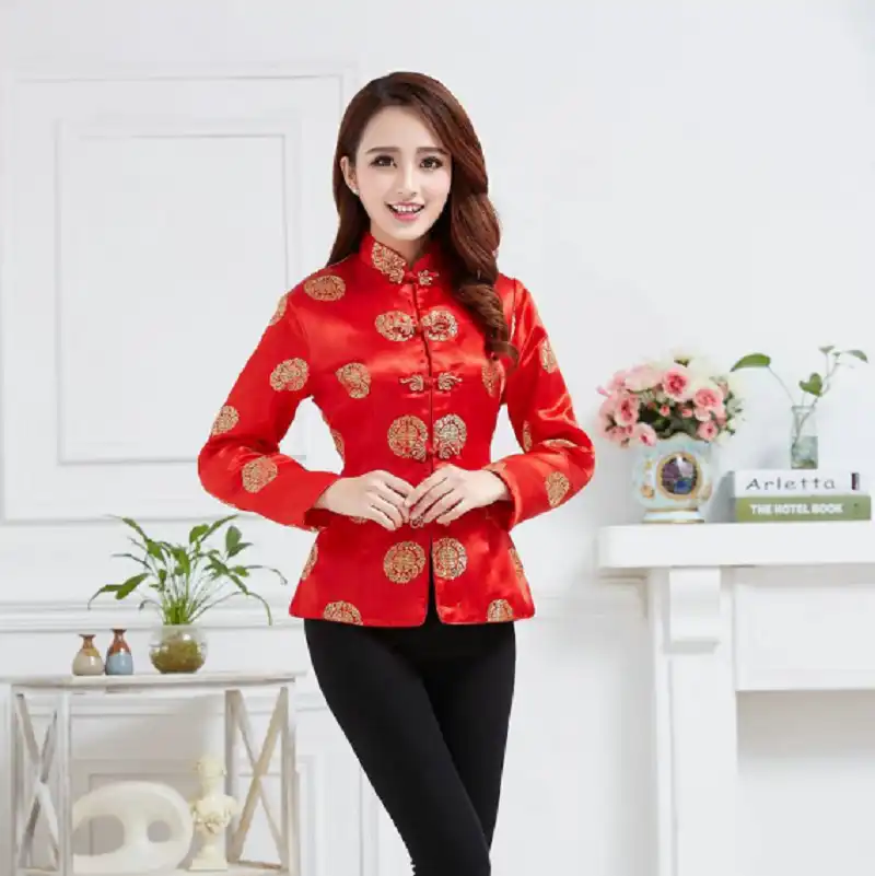 Red satin jacket collar detail highlighting authentic mandarin style and craftsmanship.