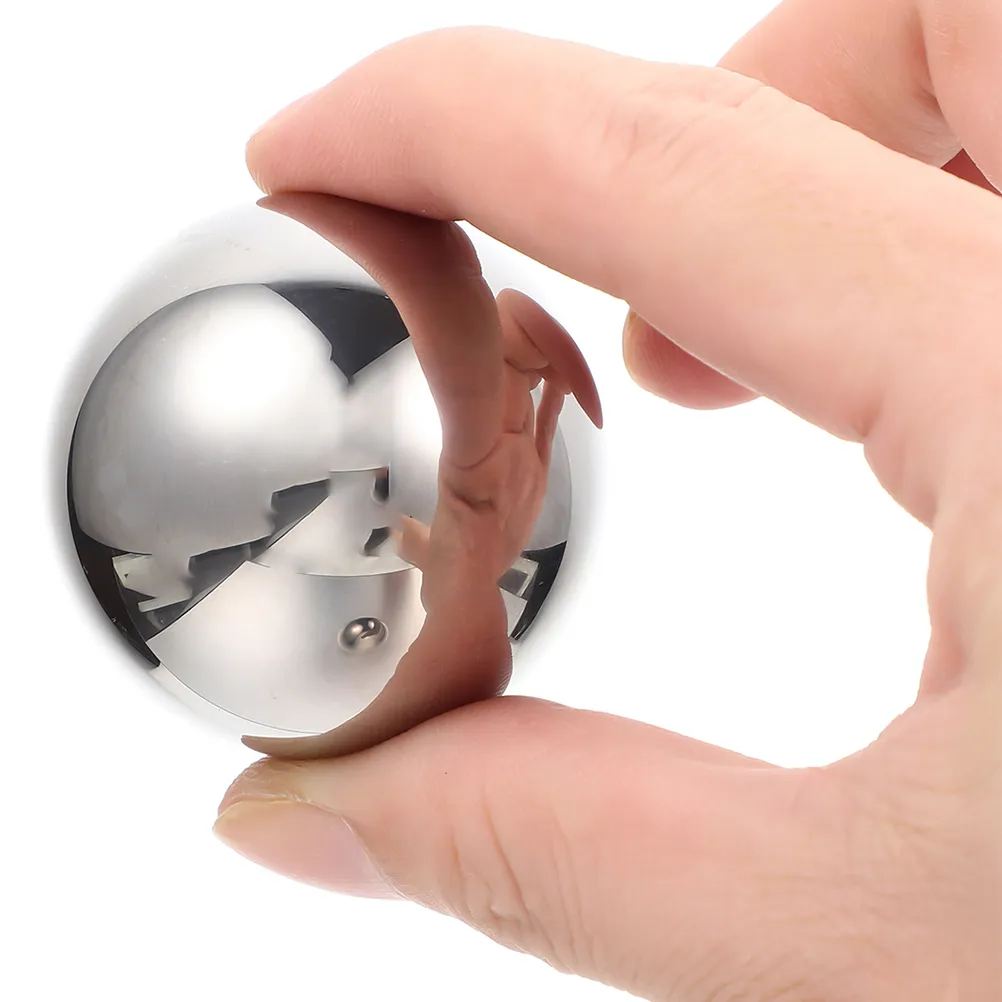 Hands demonstrating proper Baoding balls rotation technique for stress relief therapy.