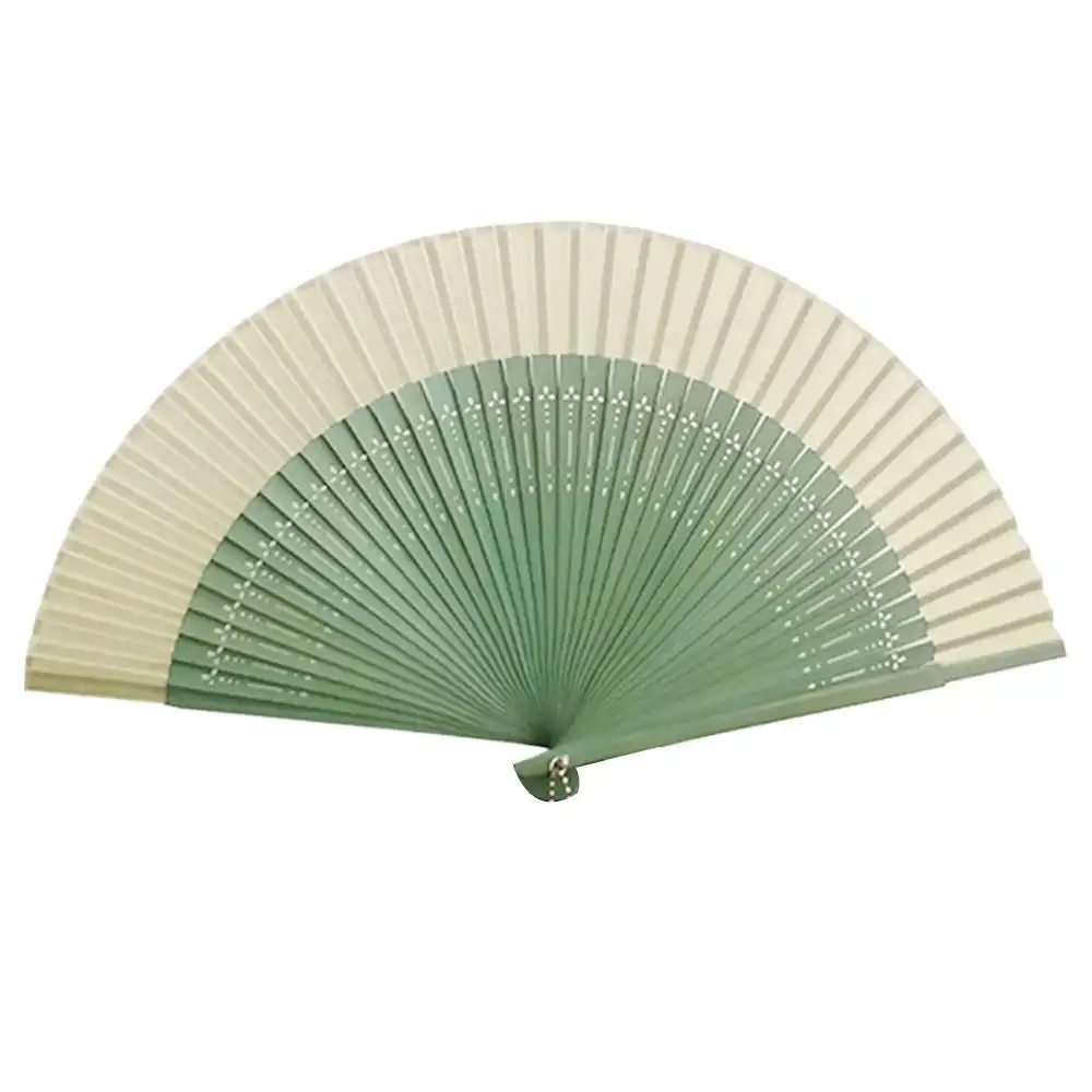 Summer cooling demonstration of portable folding fan in outdoor lifestyle setting.