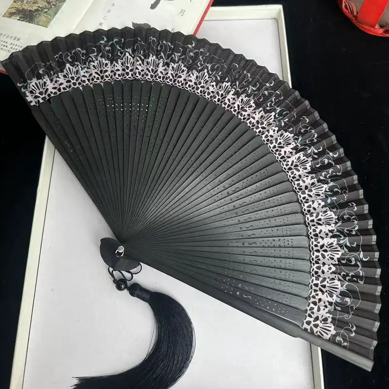 Multiple dragonfly fans arranged showing various color options and pattern variations available.