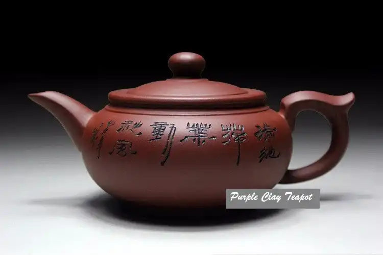 Handmade ceramic kettle spout and handle detail showing traditional Chinese craftsmanship quality.