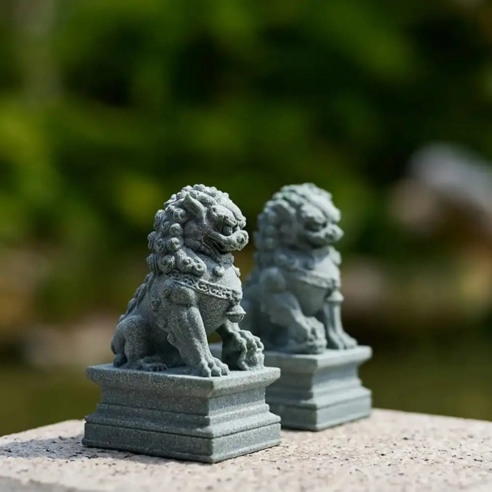 Close-up Chinese guardian lion statue stone material texture traditional foo dog pair feng shui decor.