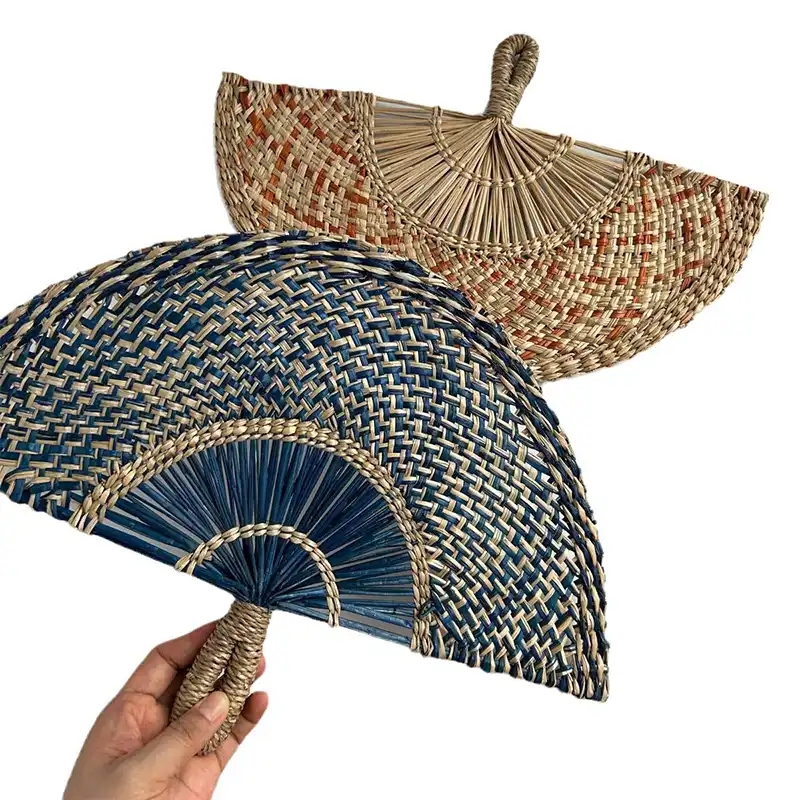Handmade straw fan mounted on wall as decorative home decor accent piece in modern setting.