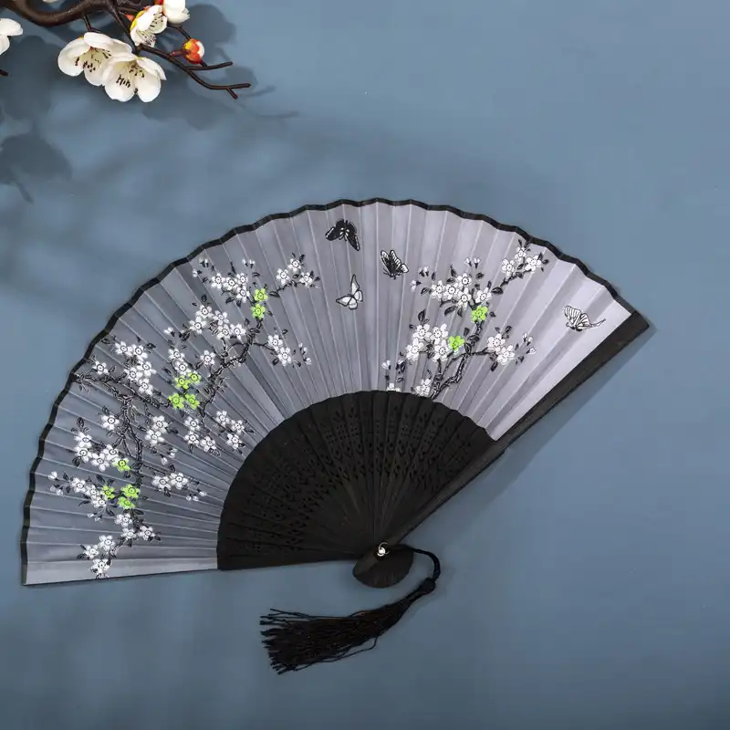 Cultural event featuring authentic Chinese fans as educational display items.