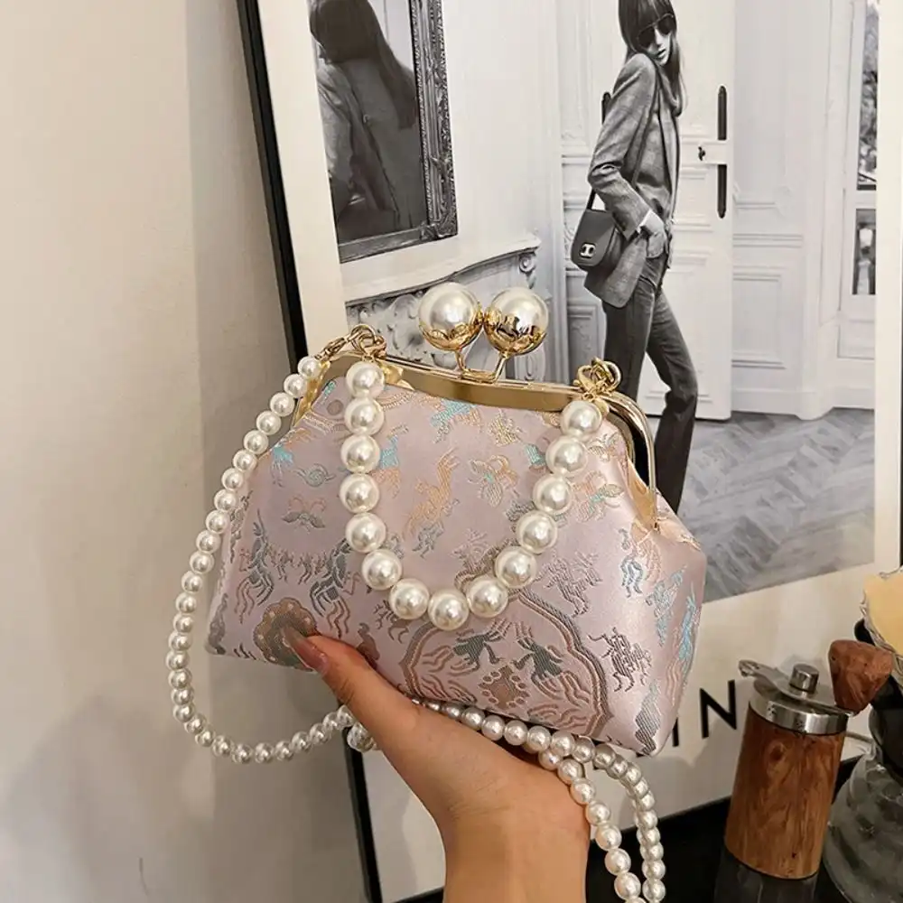 Color variations of pearl embroidery clutch bags showing available design options.