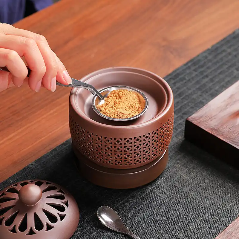 Ceramic incense burner temperature dial showing adjustable range from 0 to 320 degrees celsius.