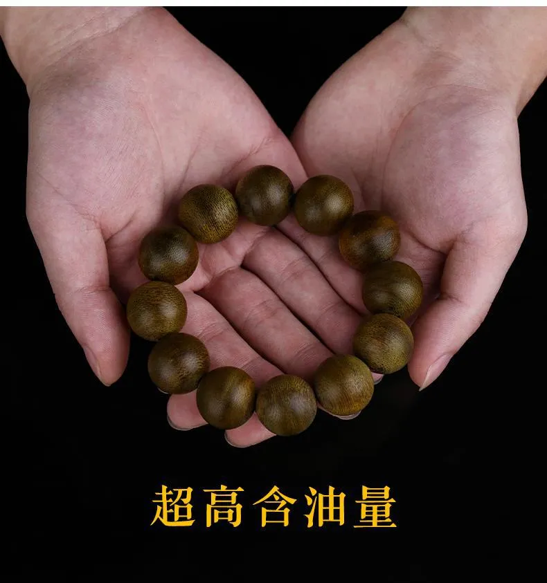 Agarwood bracelet detail showing natural wood color variations and authentic Vietnamese craftsmanship.