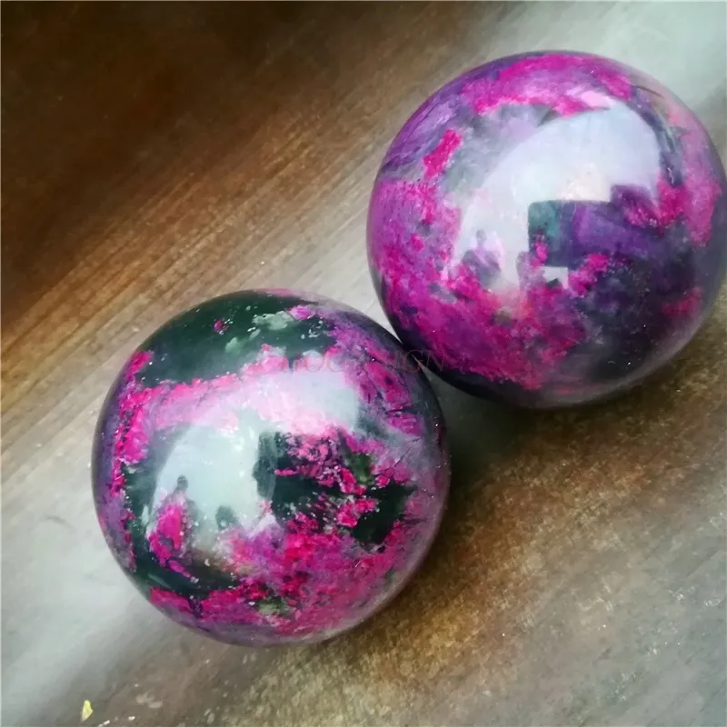 Complete Baoding ball set packaging showing two matching agate meditation balls ready for use.