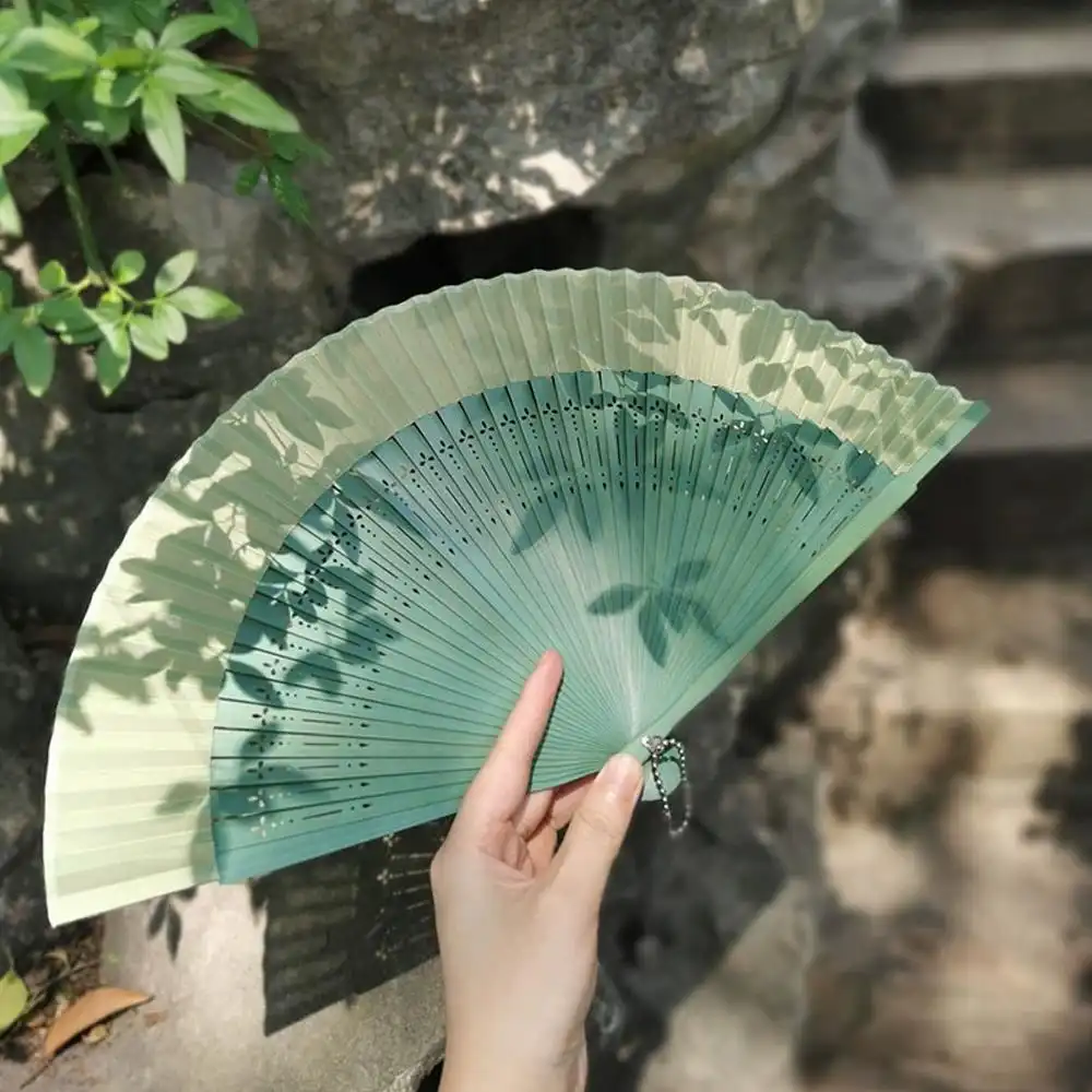 Tea ceremony setting with Japanese folding fan as traditional cultural element.