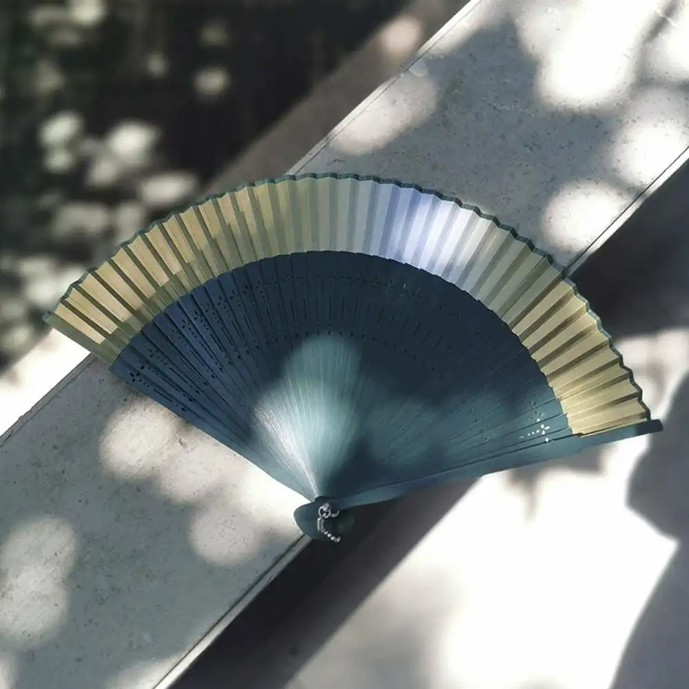 Cultural celebration featuring traditional folding fans as ceremonial accessories.