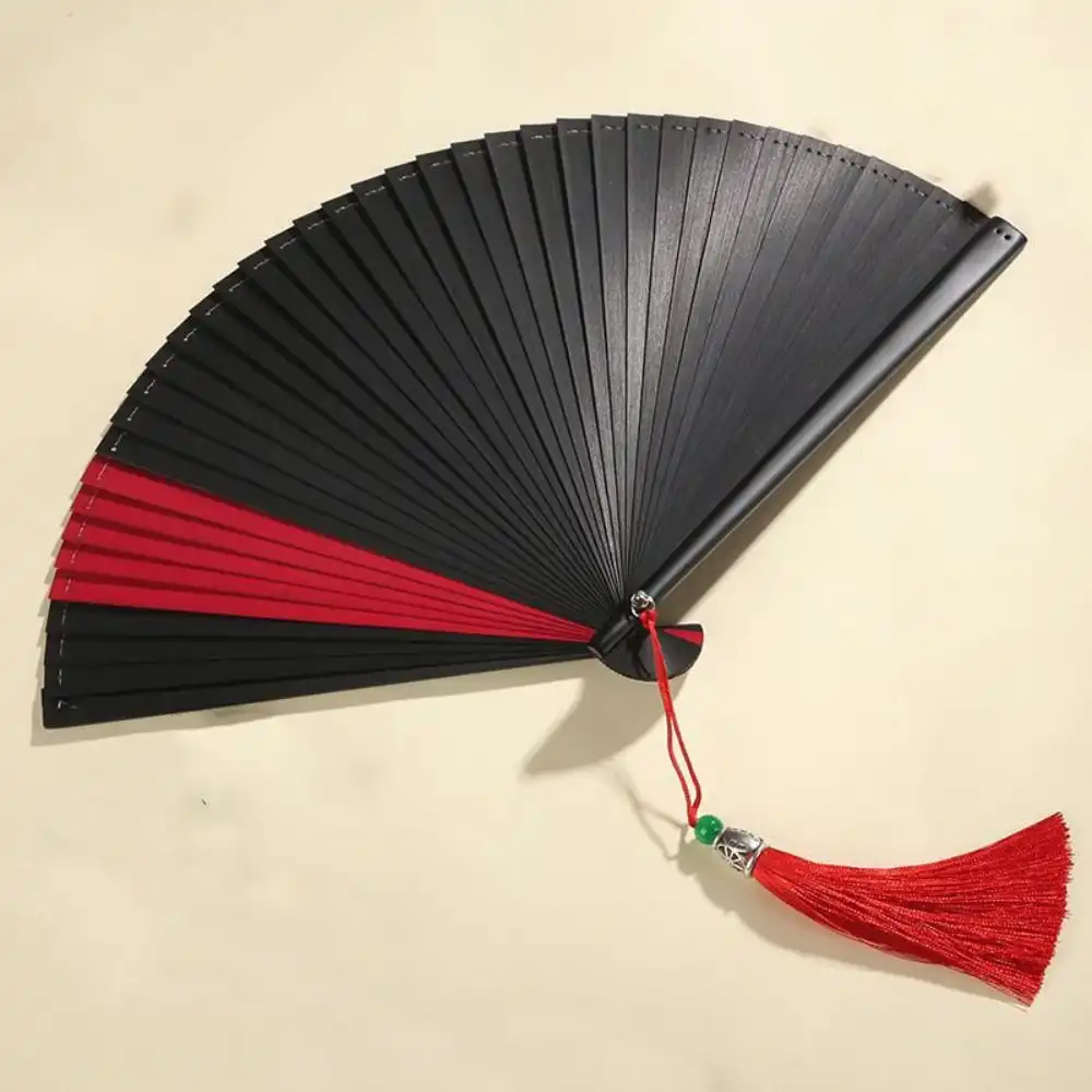 Comparison showing compact folded size versus fully opened dance fan dimensions.
